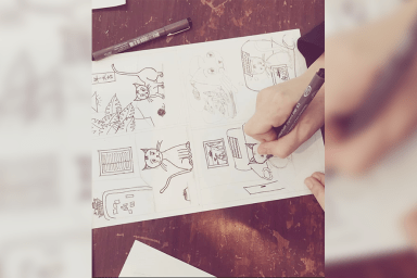 Photo d'une planche de manga en cours de réalisation